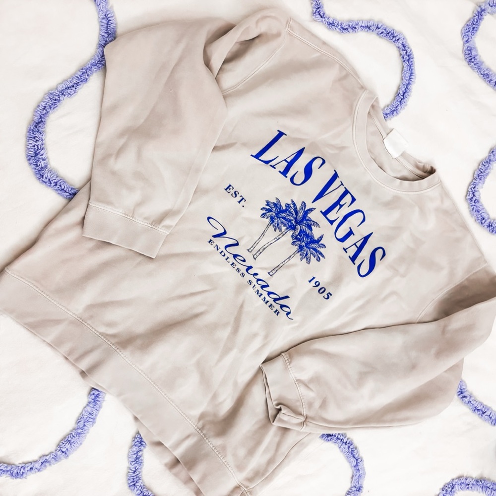 Ocean Drive Beige Sweatshirt with Blue Lettering